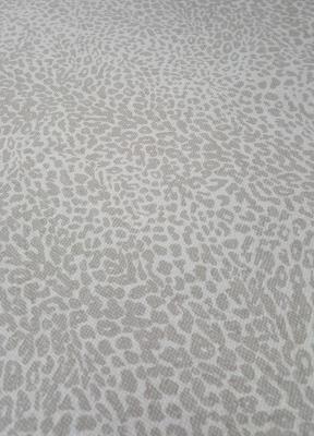 Tessuto fantasia maculata tinta sabbia 100% cotone altezza 2,90 cm.